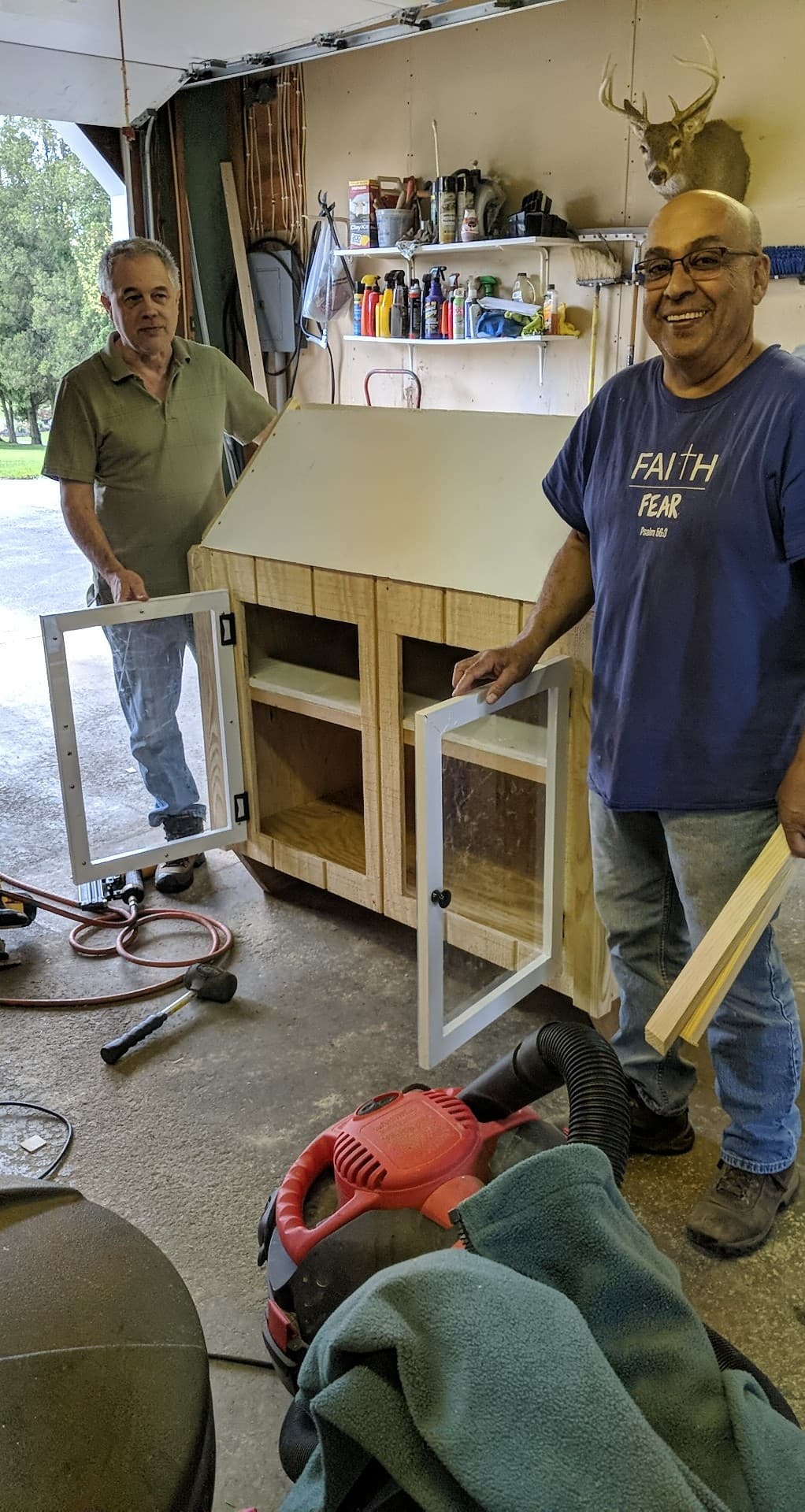 Ed Ferrer and Rick Roxby make a Blessing Box food pantry